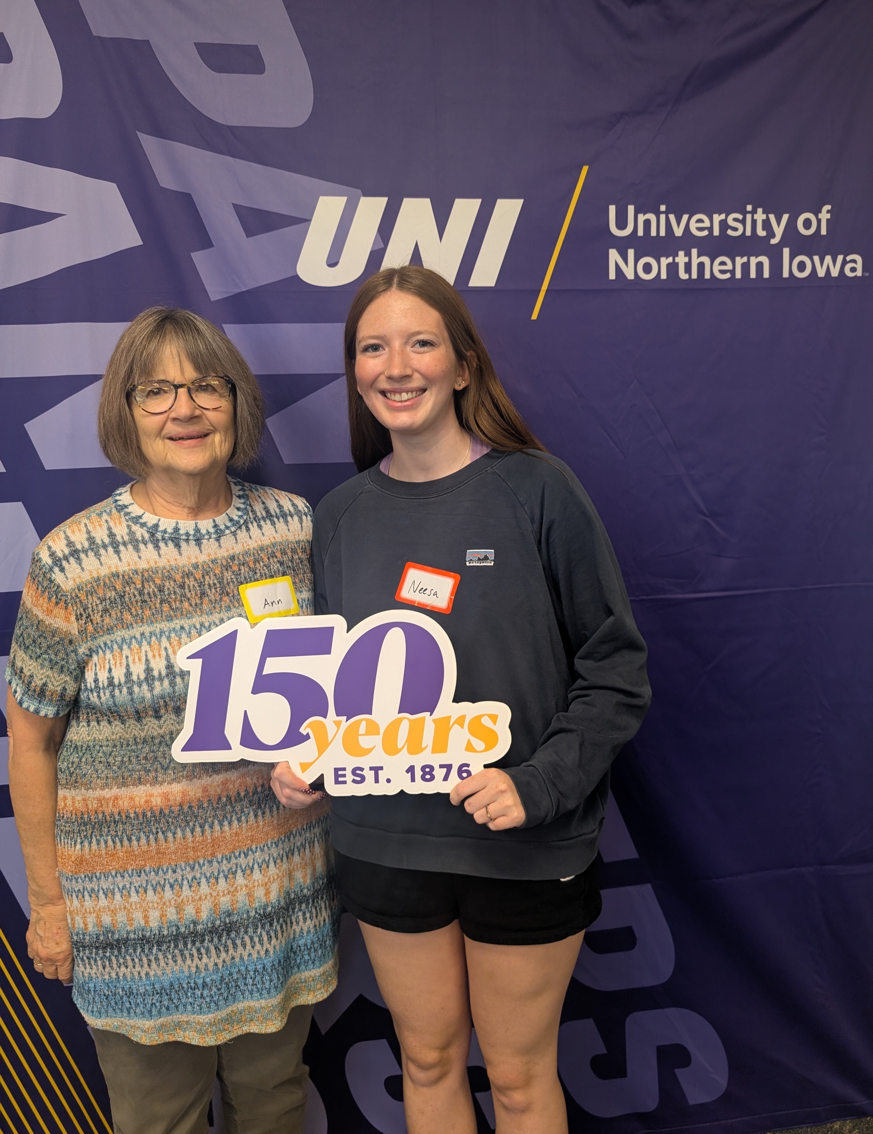 Neesa Striegel and Ann holding 150 years sign