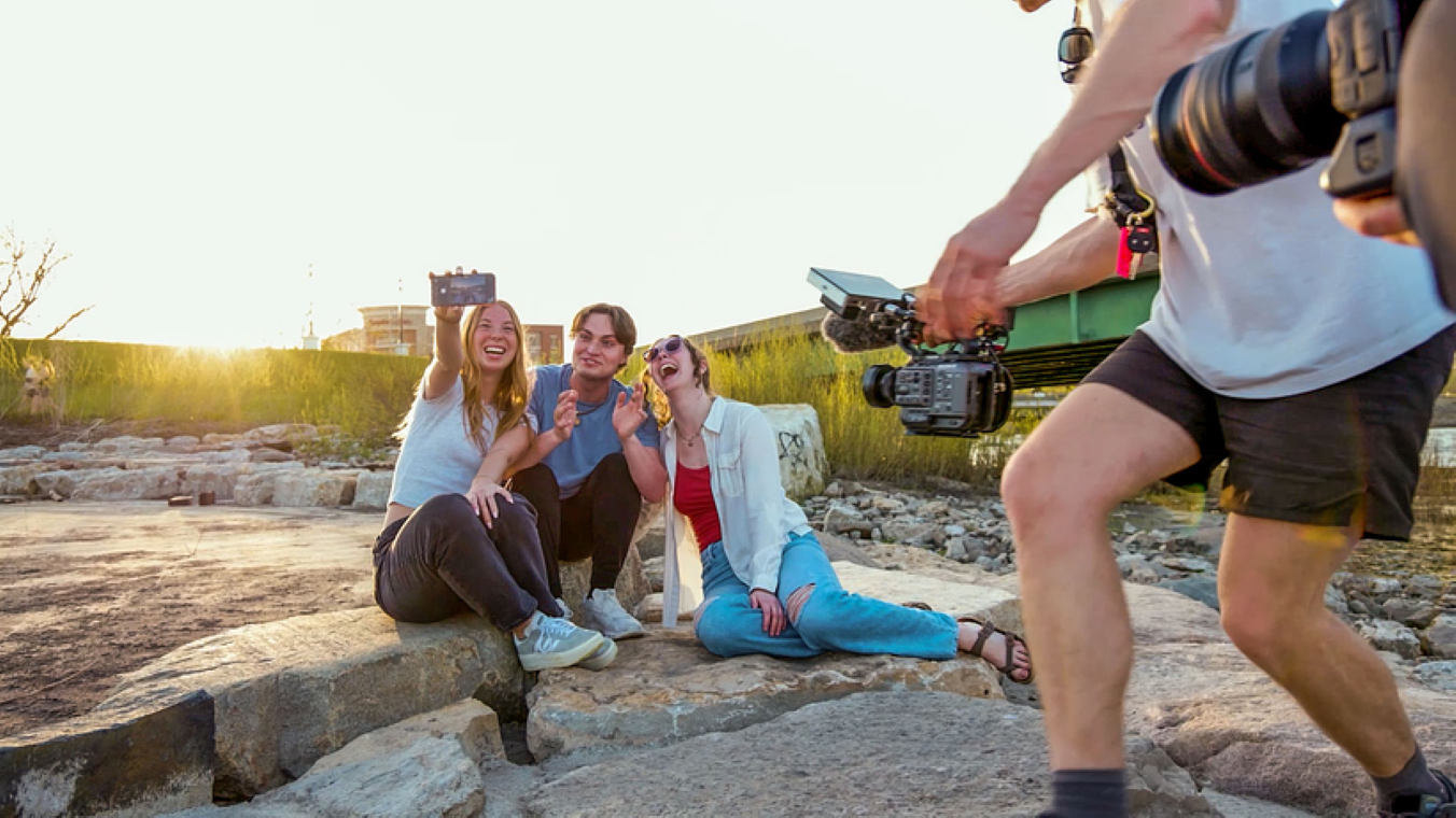 Students laugh while taking a selfie for the UNI TV spot