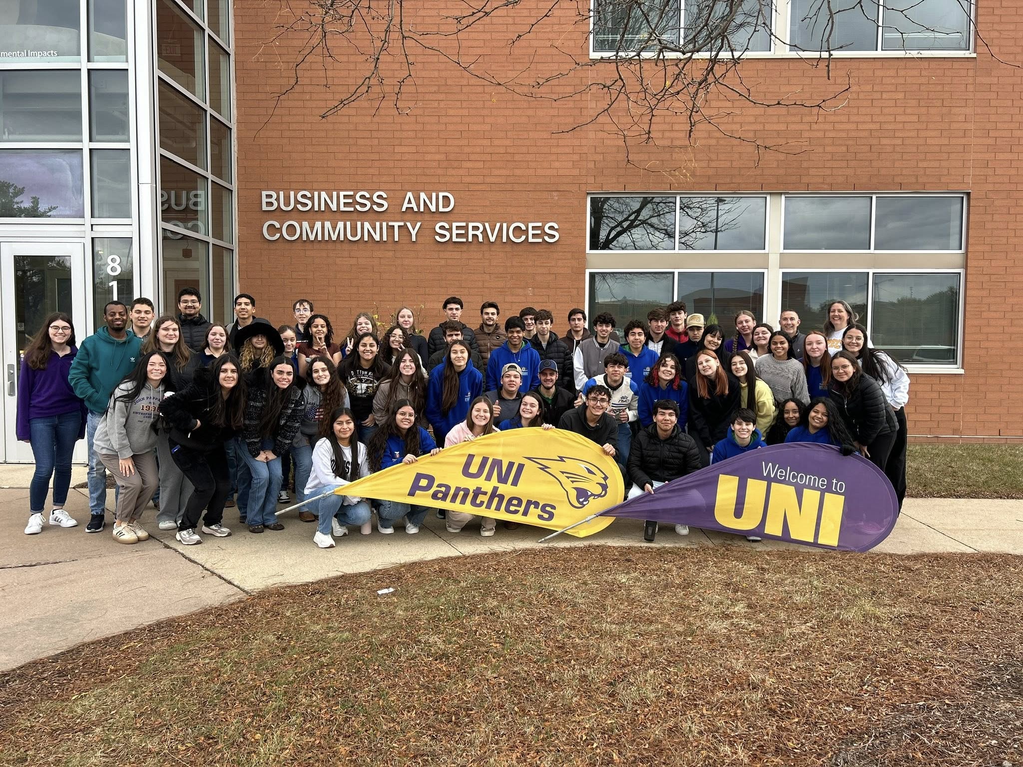 Brazilian students in front of the Business & Community Services building