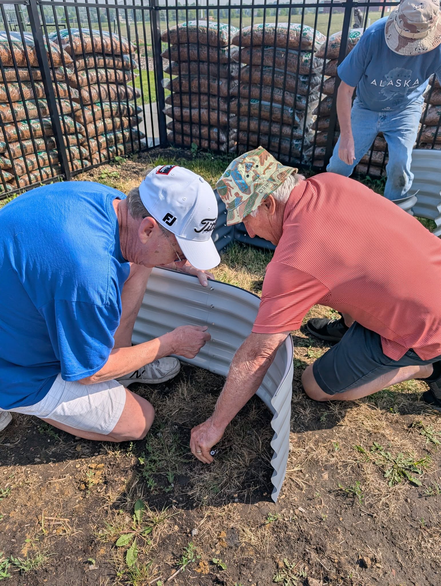Men's Sheds participants building raised garden beds