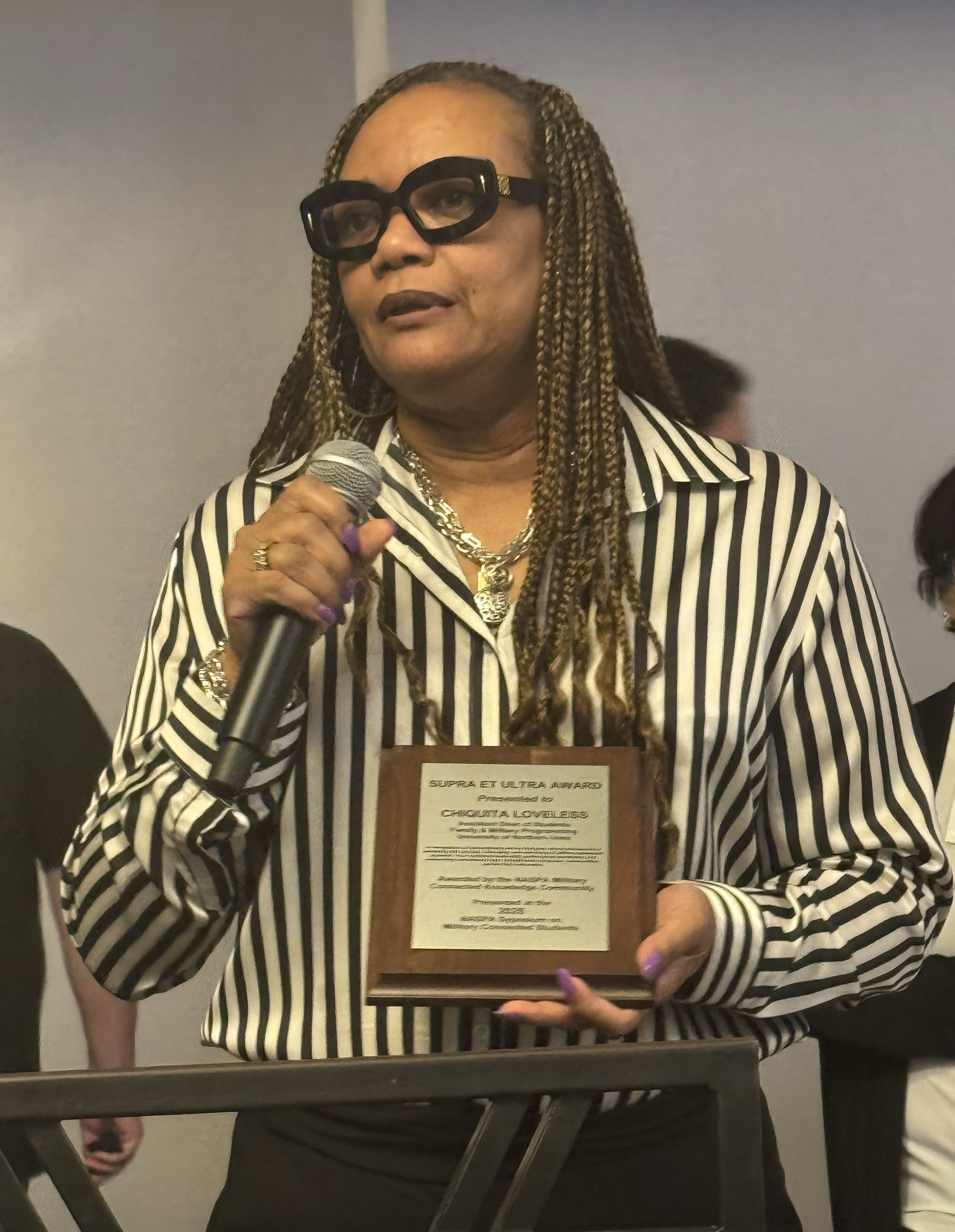 Chiquita Loveless receiving an award