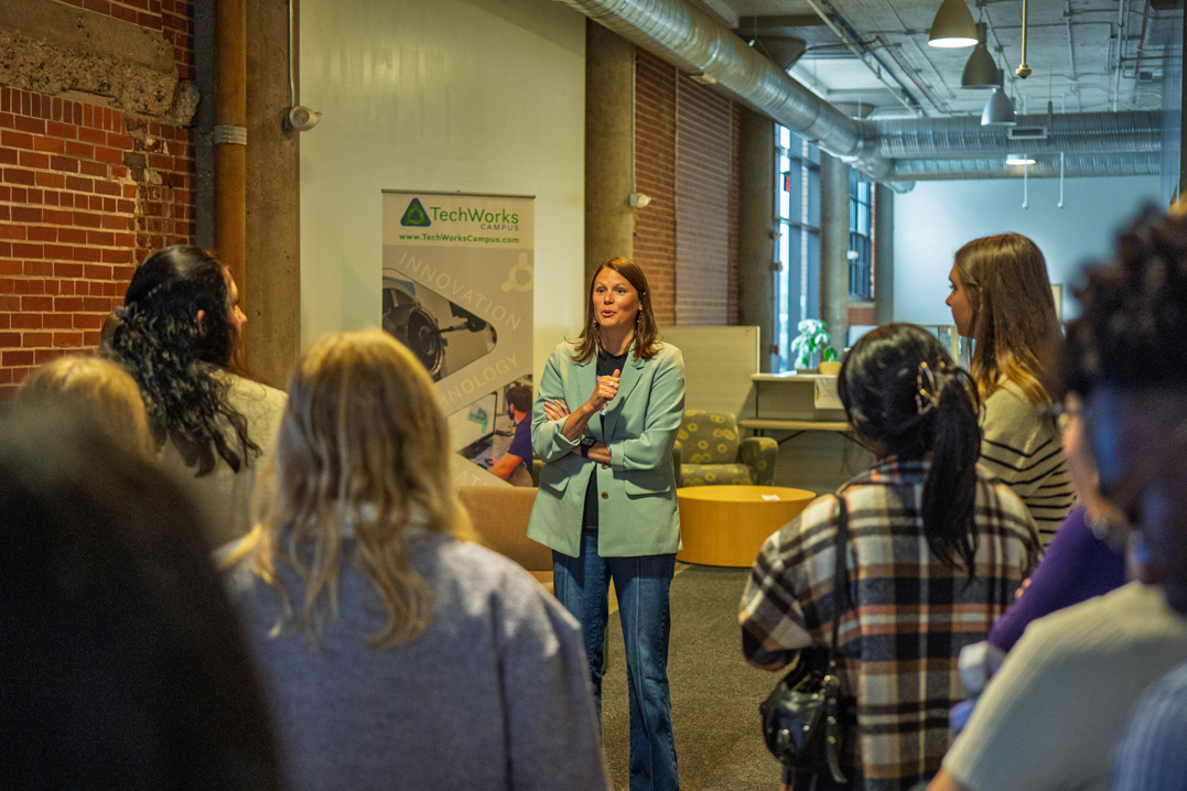 Students listen to Grow Cedar Valley President and CEO, Katy Susong, during the Wilson in the Valley event.