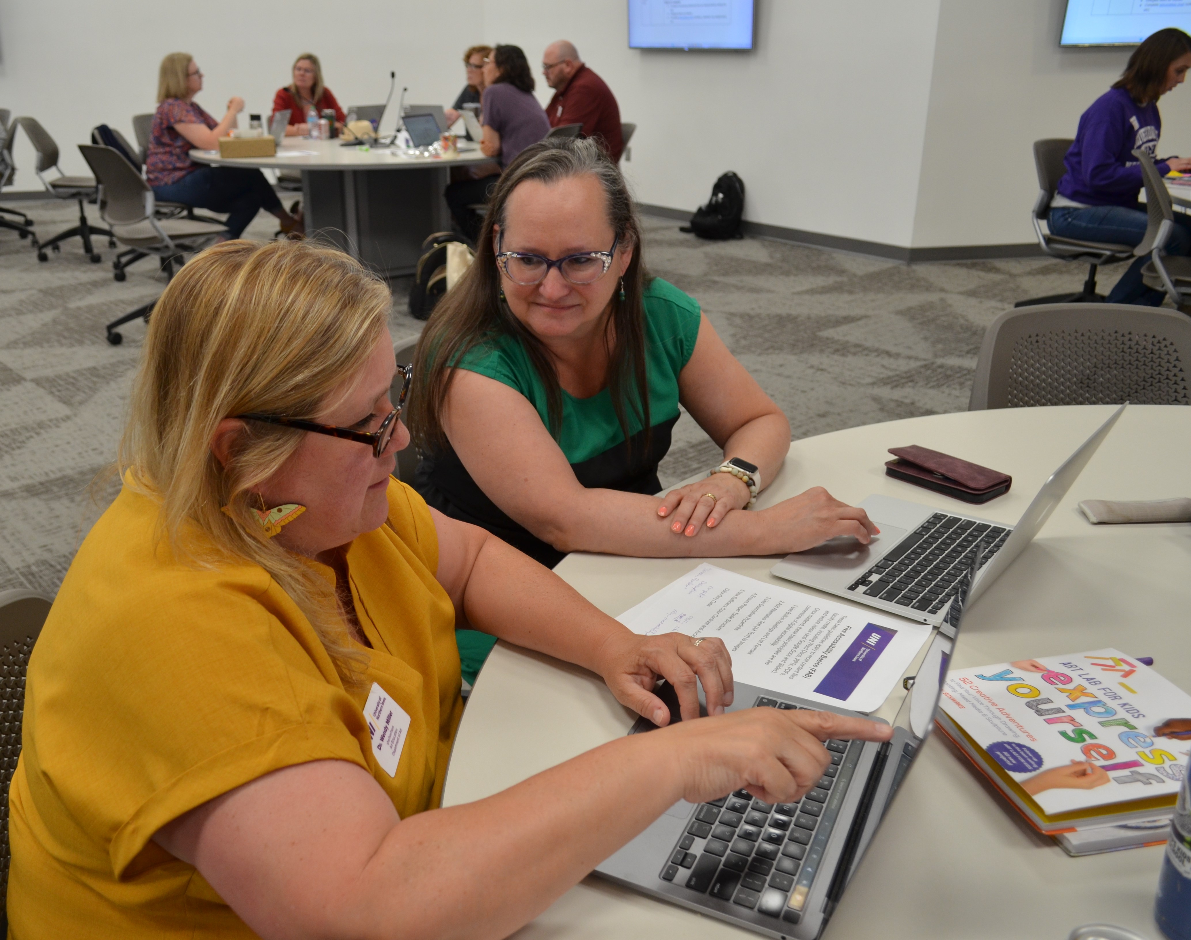 Wendy Milller working with Becky Hawbaker on pairing methods and internship coursework
