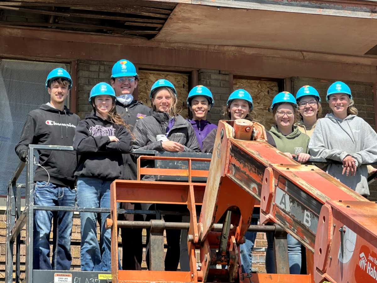 Day of Service volunteers in hard hats