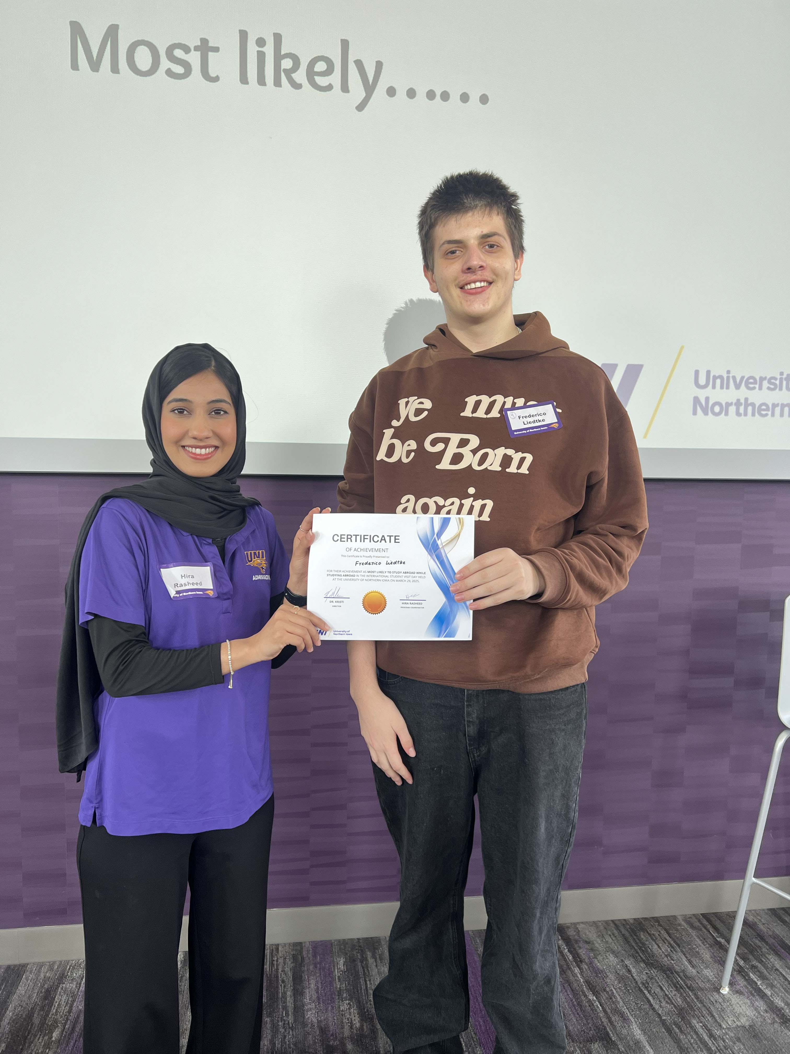 Frederico Liedtke holding a "most likely to" certificate