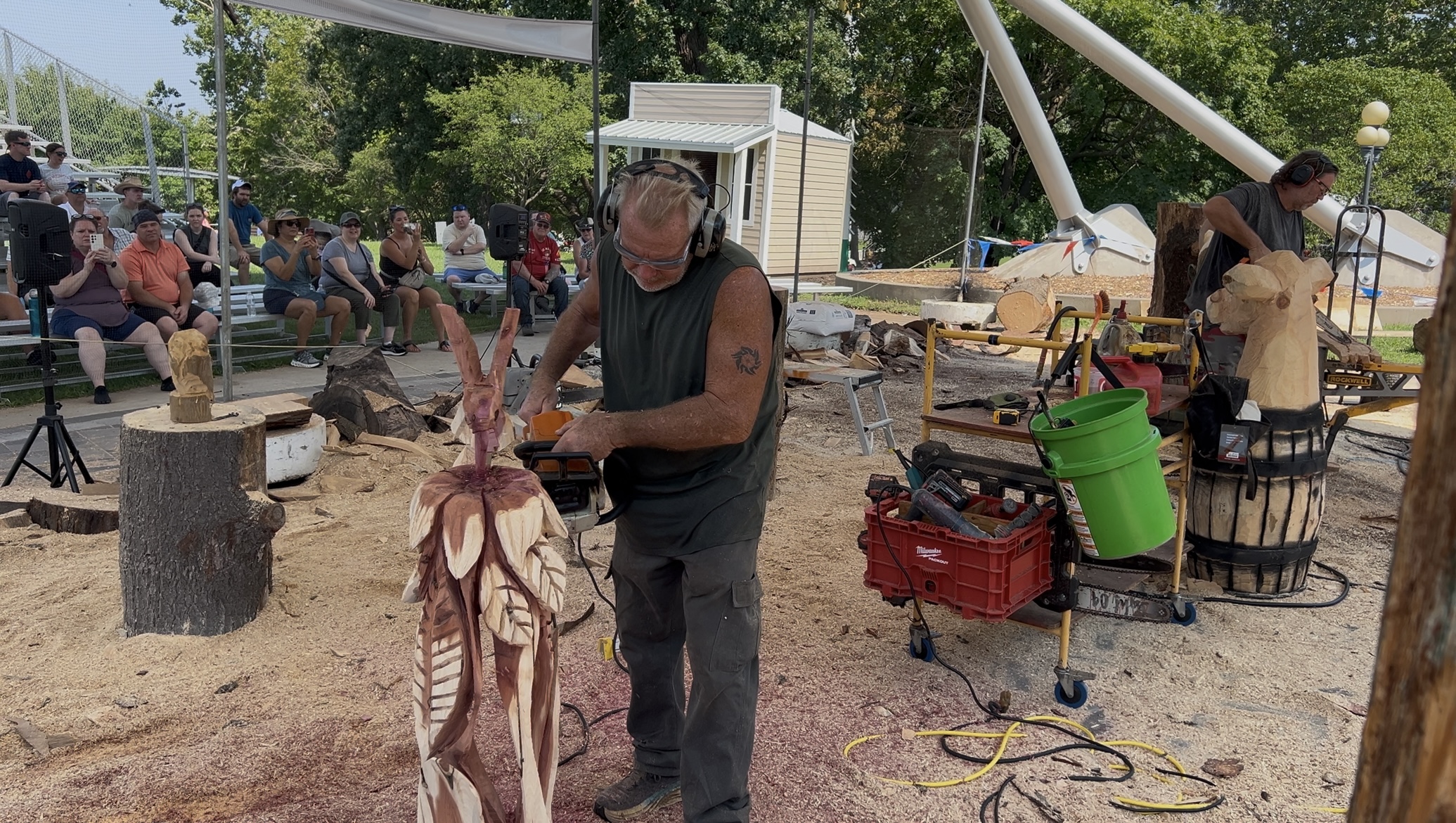 Gary Keenan chainsaw sculpting a log at the Iowa State Fair