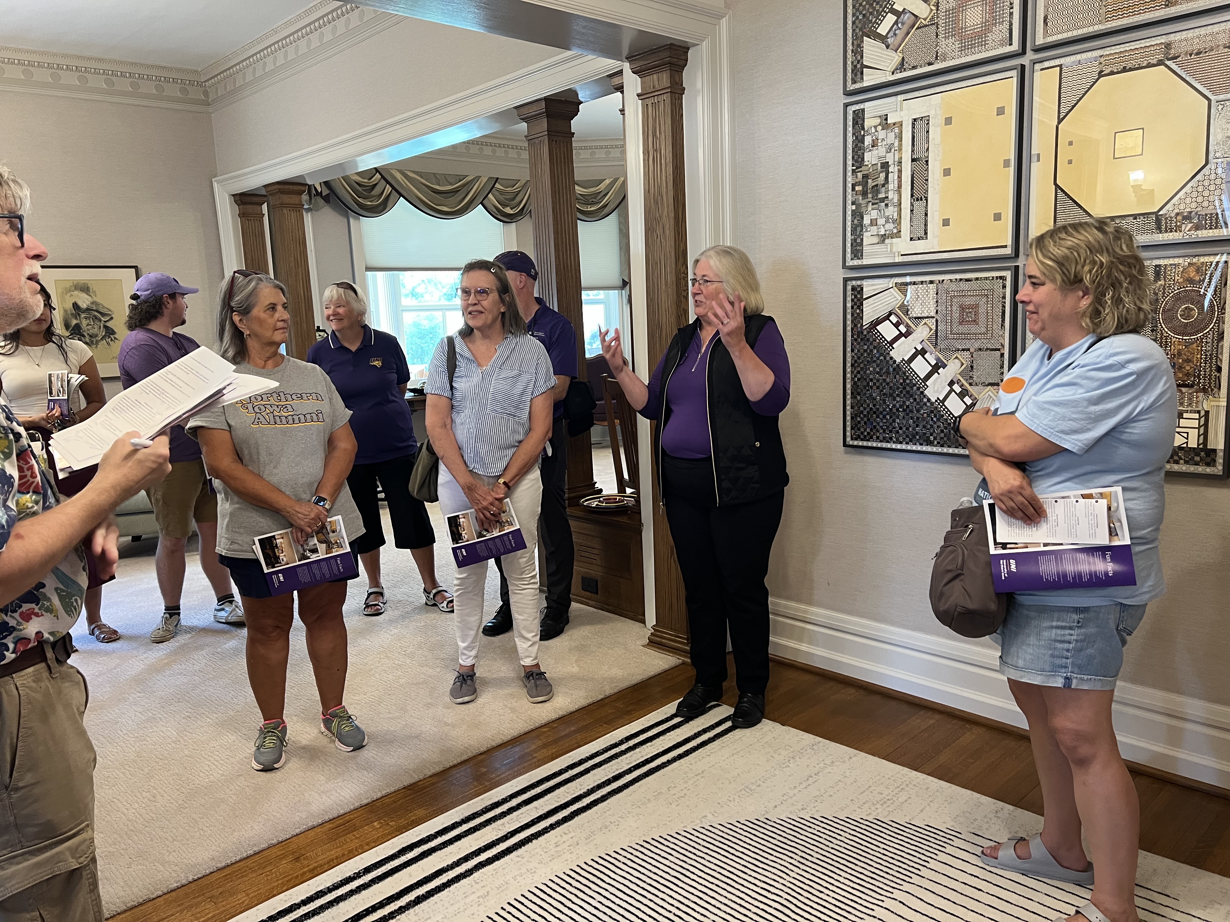 Participants of the walking tour gather inside the President's House.
