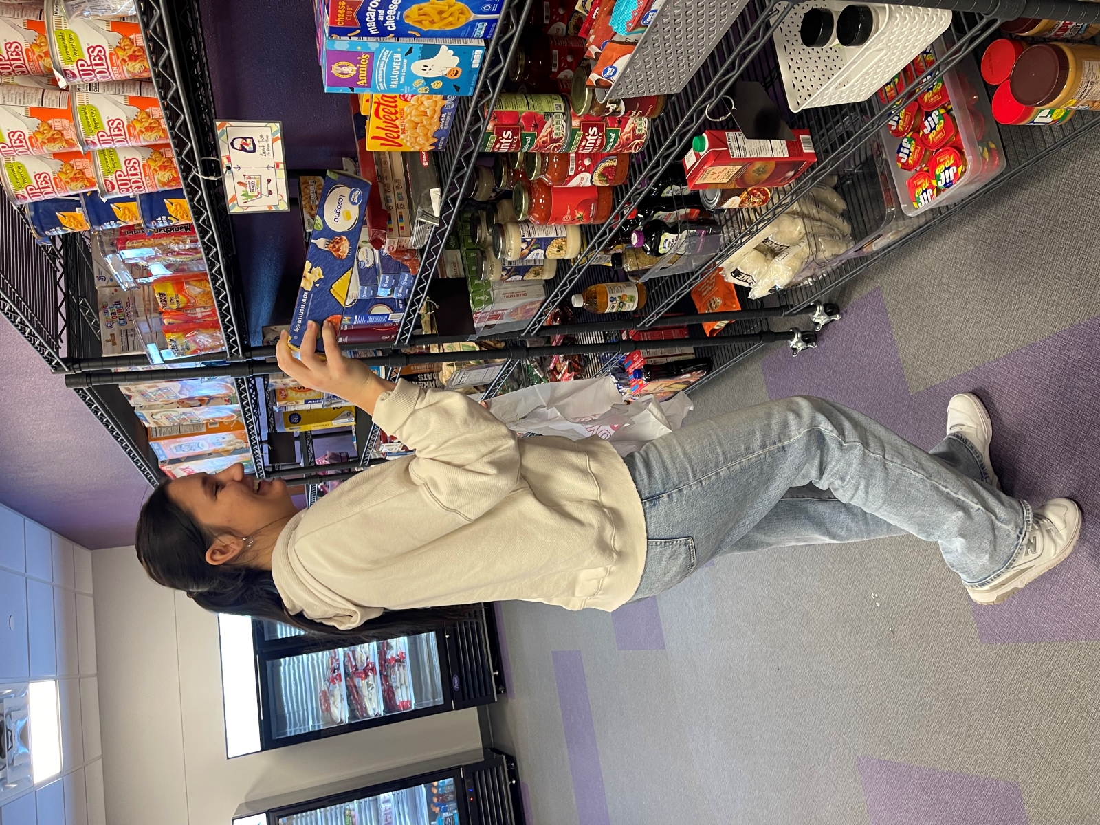 Student browsing Panther Pantry shelves