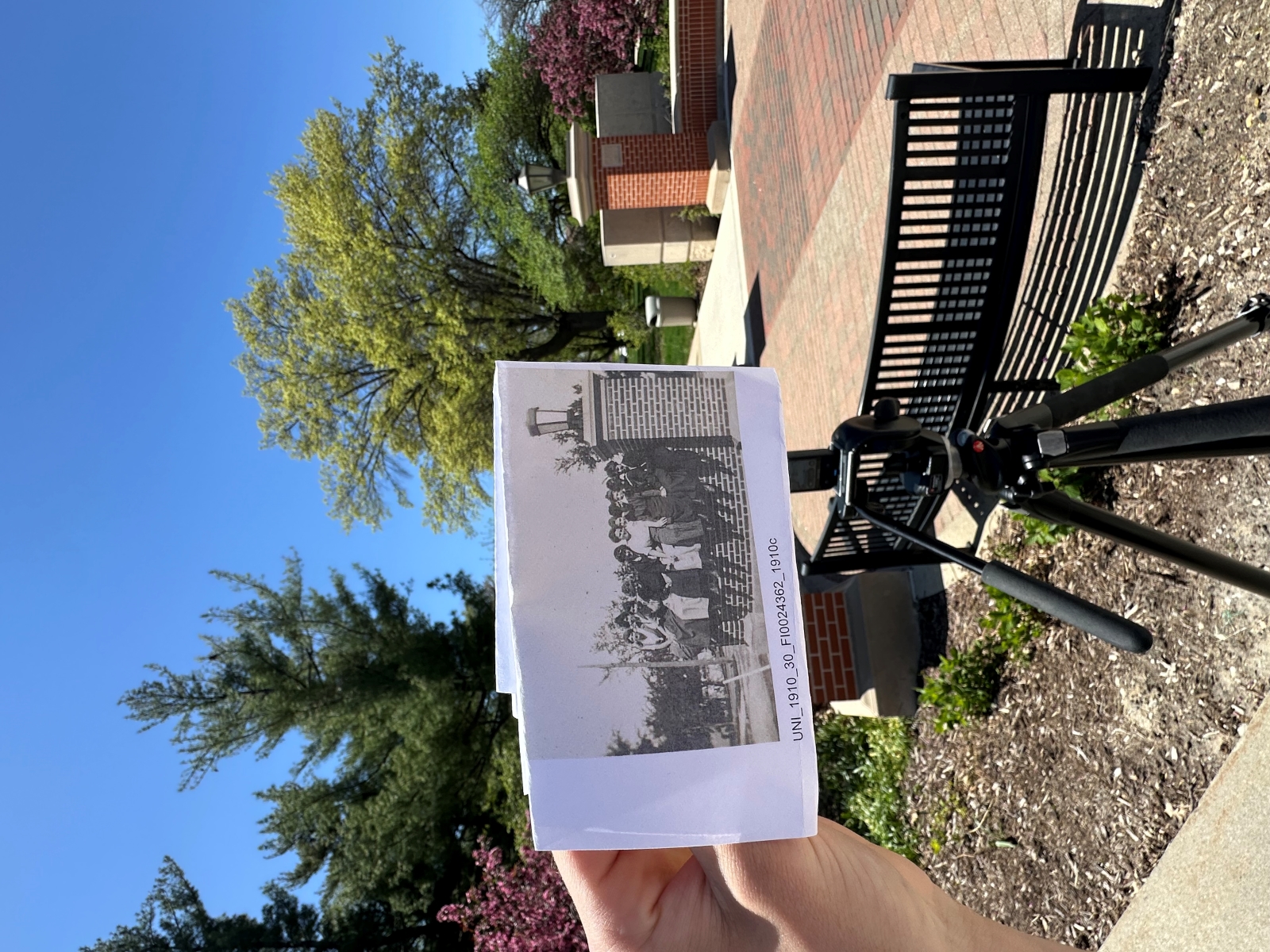 Zach Rogers holding historic UNI image up to camera