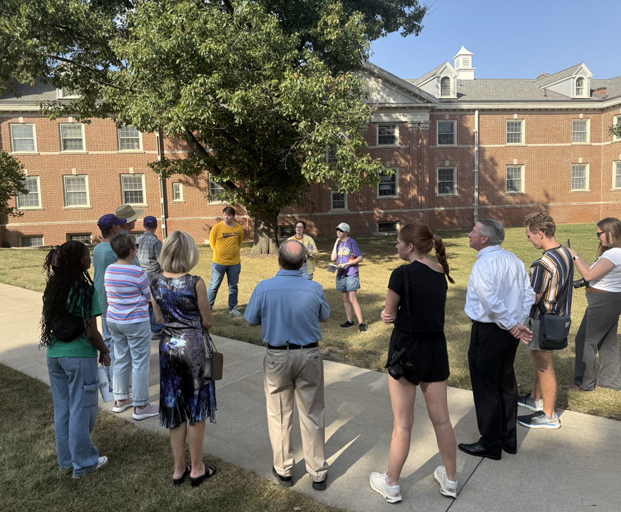 Students guide students and alumni on a UNI walking tour showcasing the campus' architecture. 