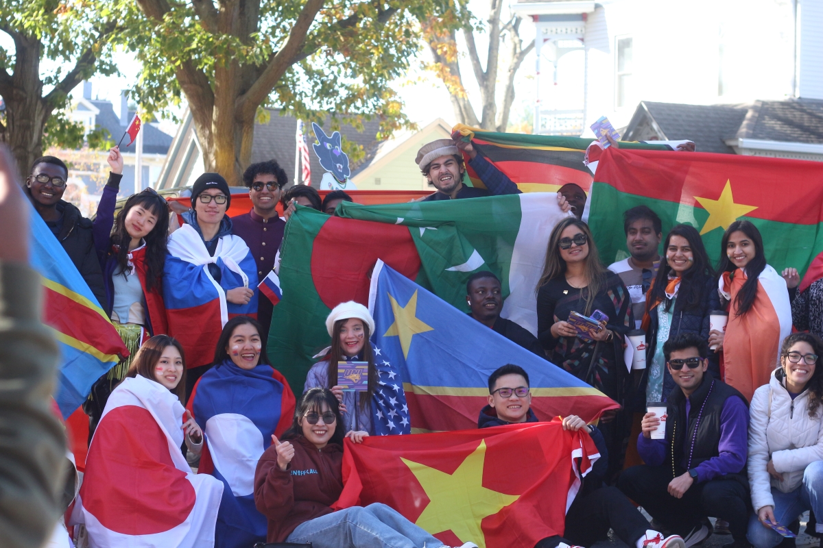 International students show off the flags of their home countries