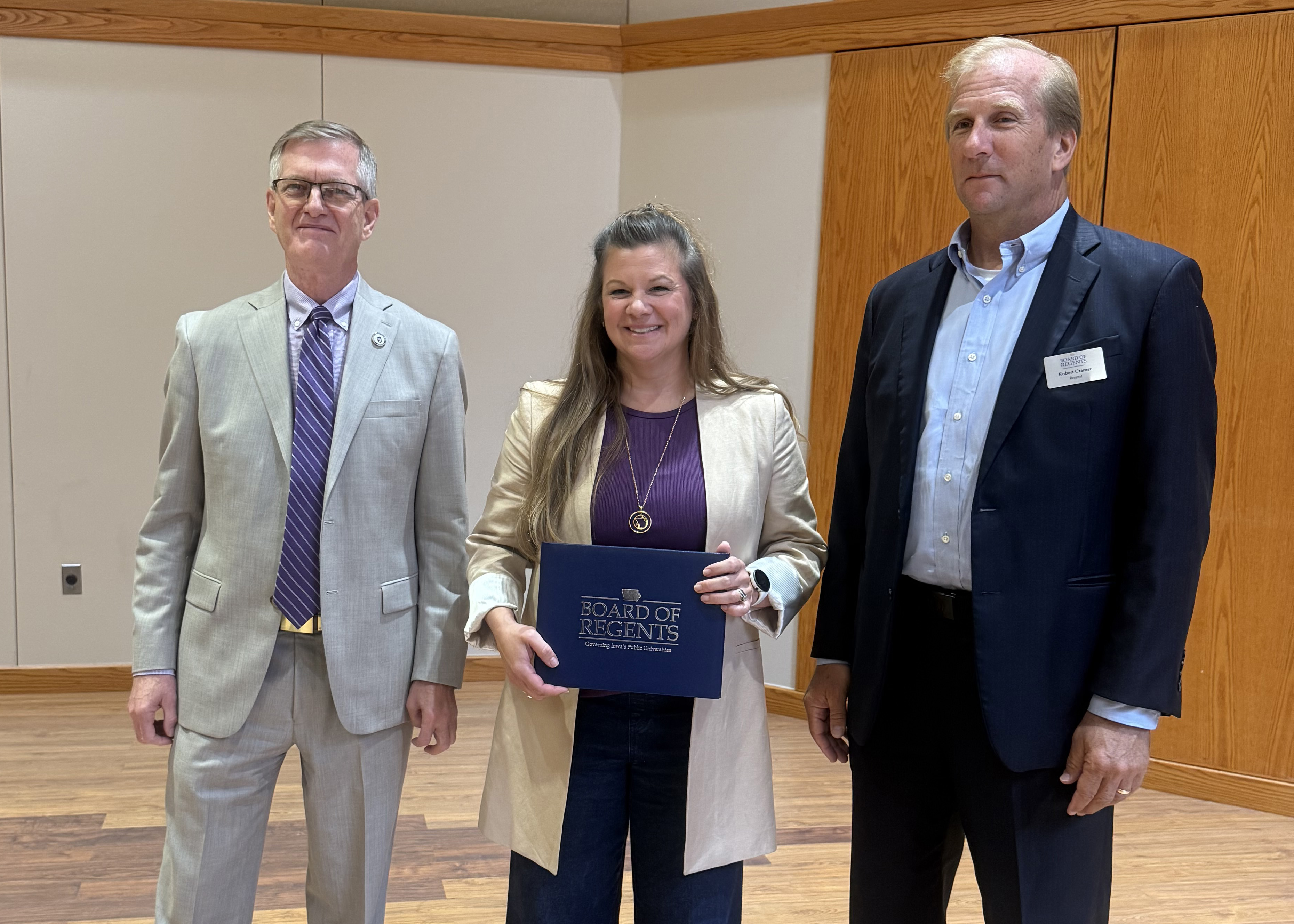 Stacia Eggers accepting her Regents Award for Staff Excellence