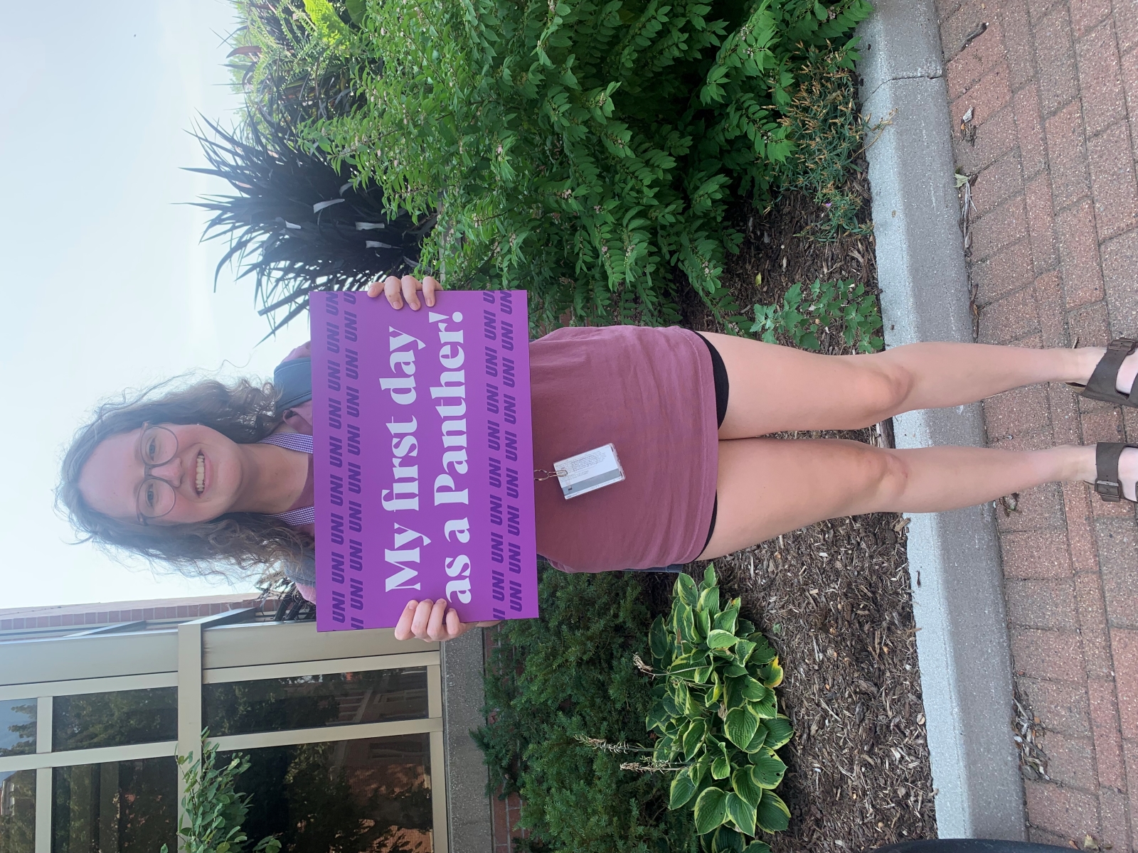 Jacey Ordal holding a "My first day as a Panther" sign