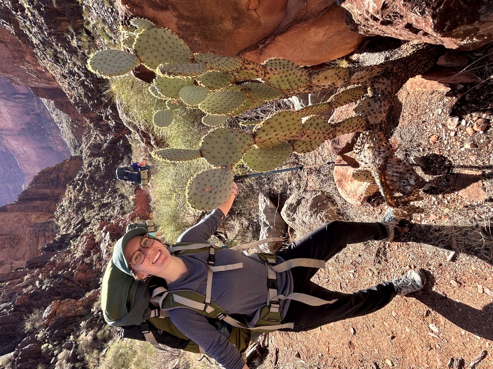 Jessica McMurrin in the desert next to a cactus