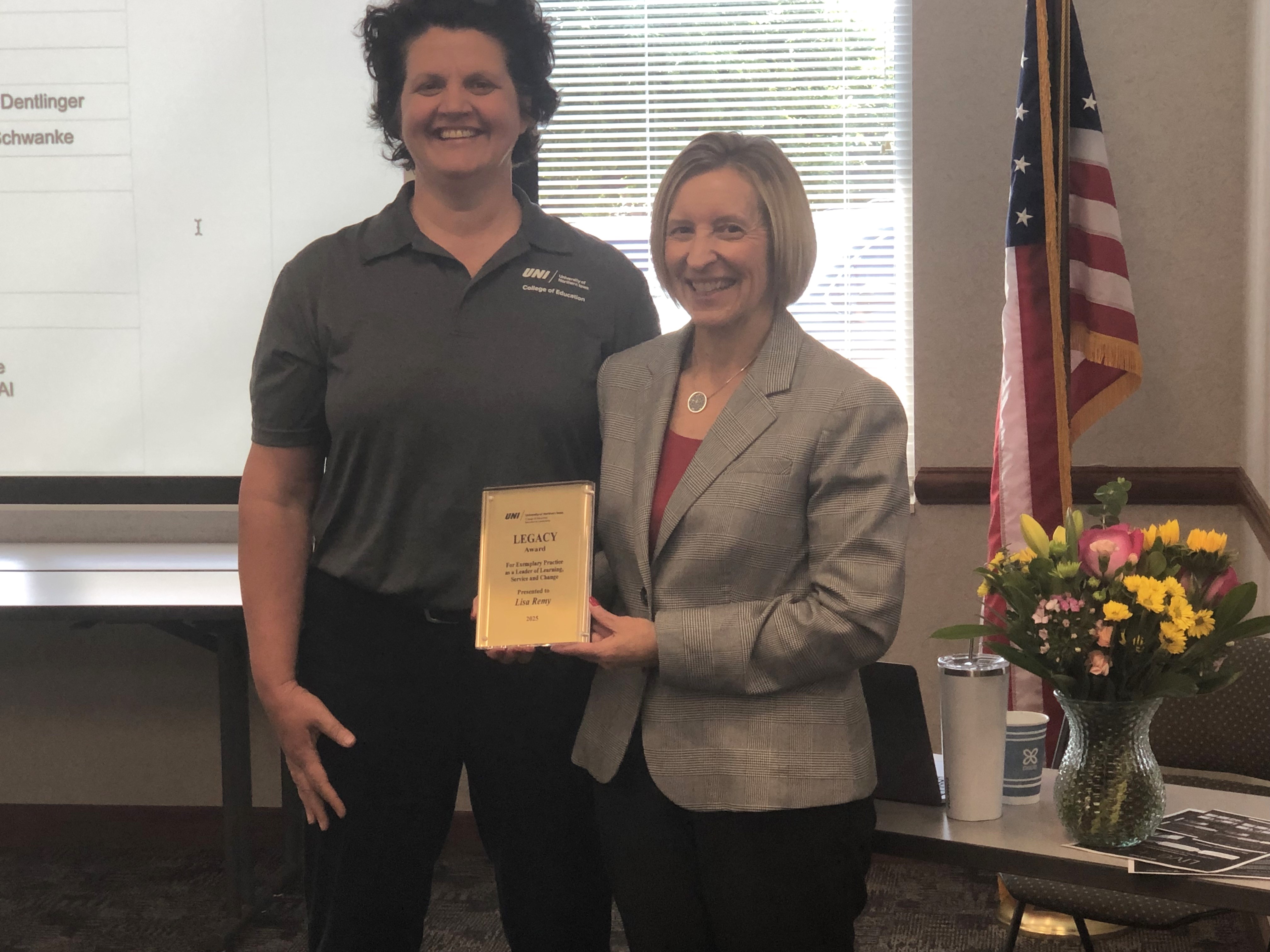 Lisa Remy receives Educational Leadership Legacy Award from Sharon Dentlinger