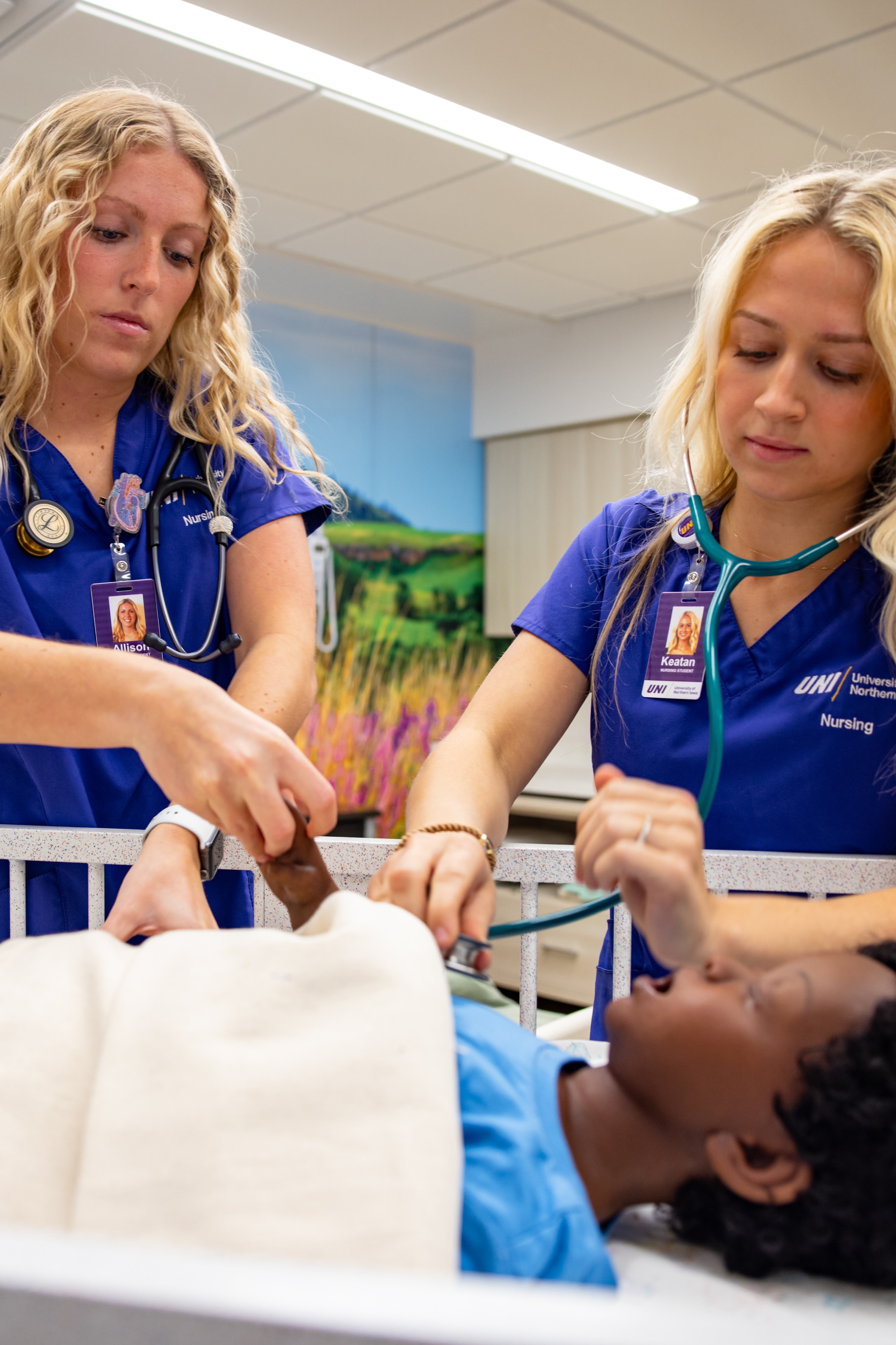 Nursing students with pediatric simulator