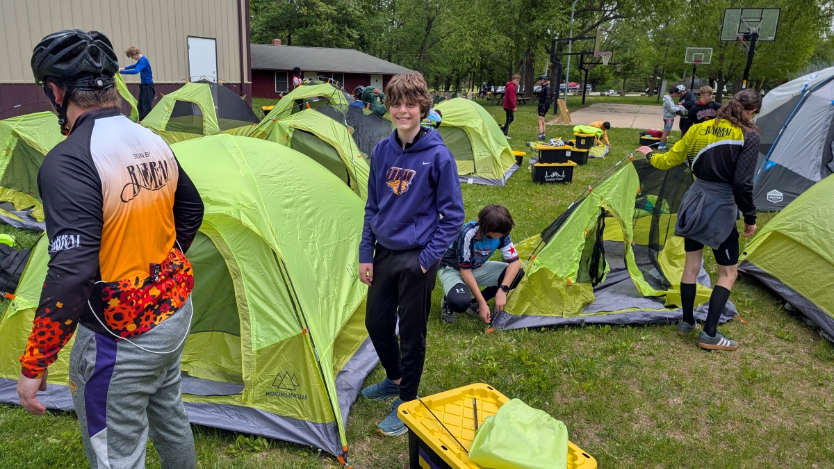 Young bikers setting up tents