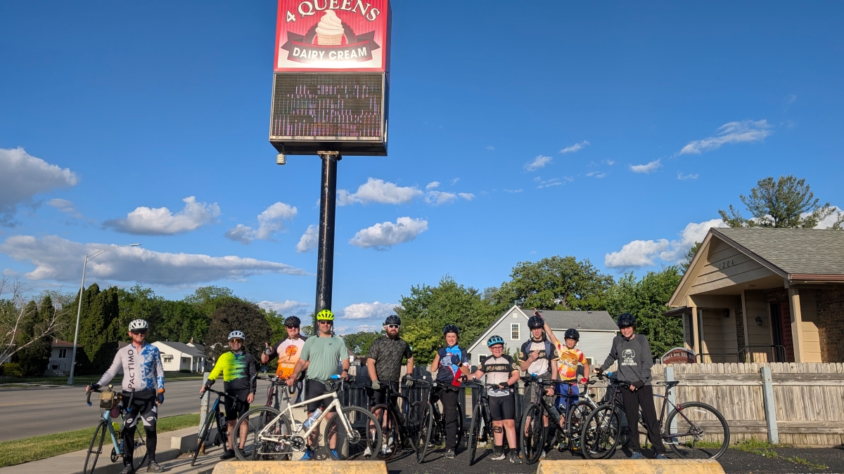 Group of young bikers posing at 4 Queens