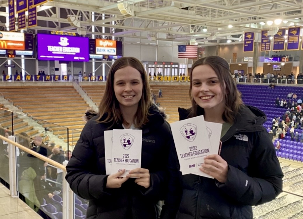 Sydney and Paige Hollingshead with Teacher Convocation programs