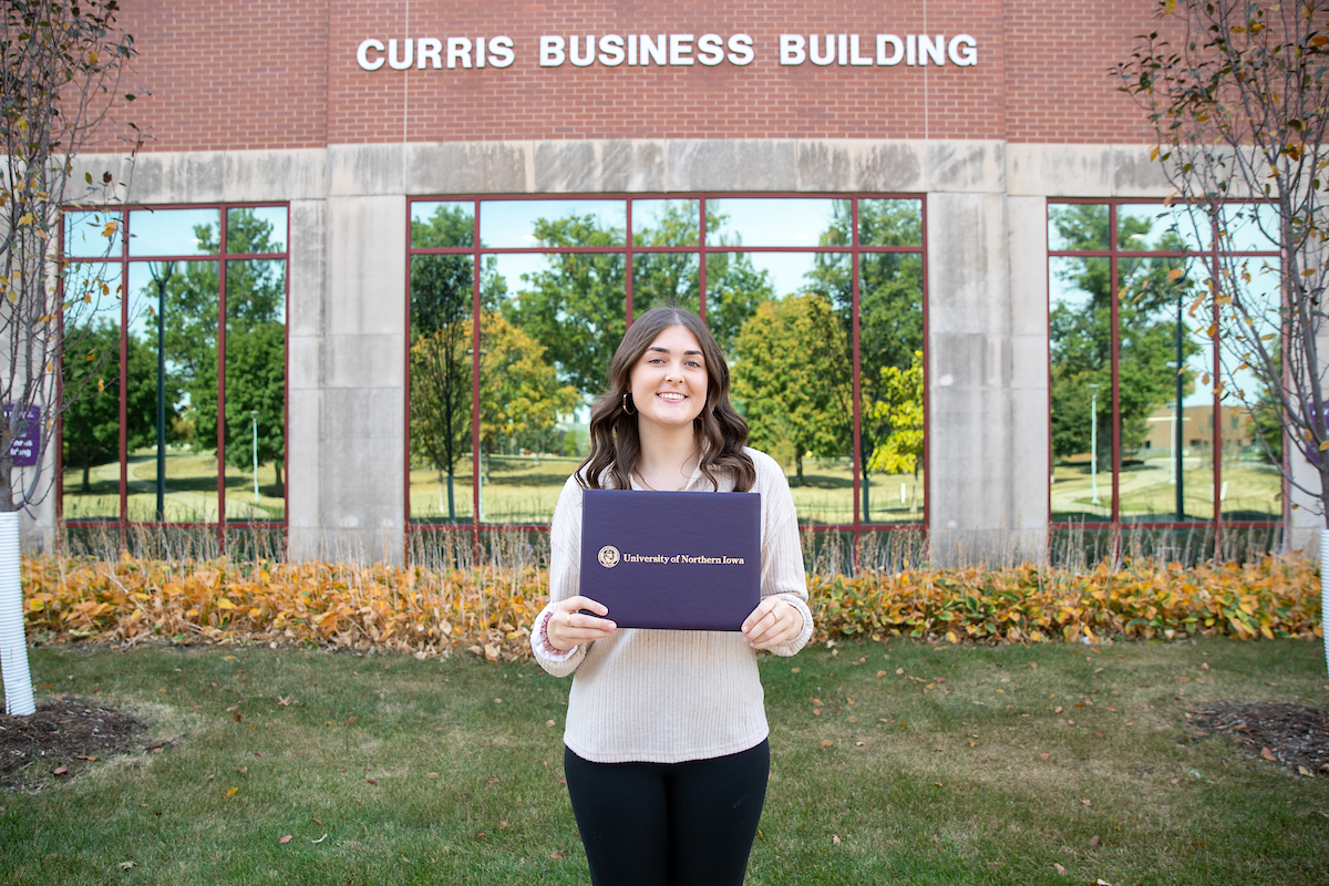 Jenna Meyer in front of Curris Business Building