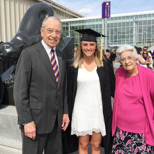 Grassley and his wife with their granddaughter.