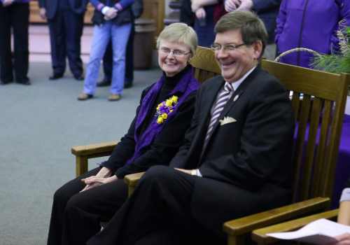 Geadelmann sitting next to President Bill Ruud at her retirement celebration in 2015.