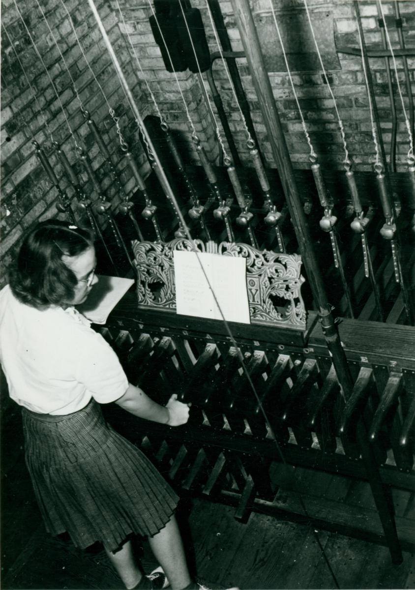 Woman playing carillon in 1947