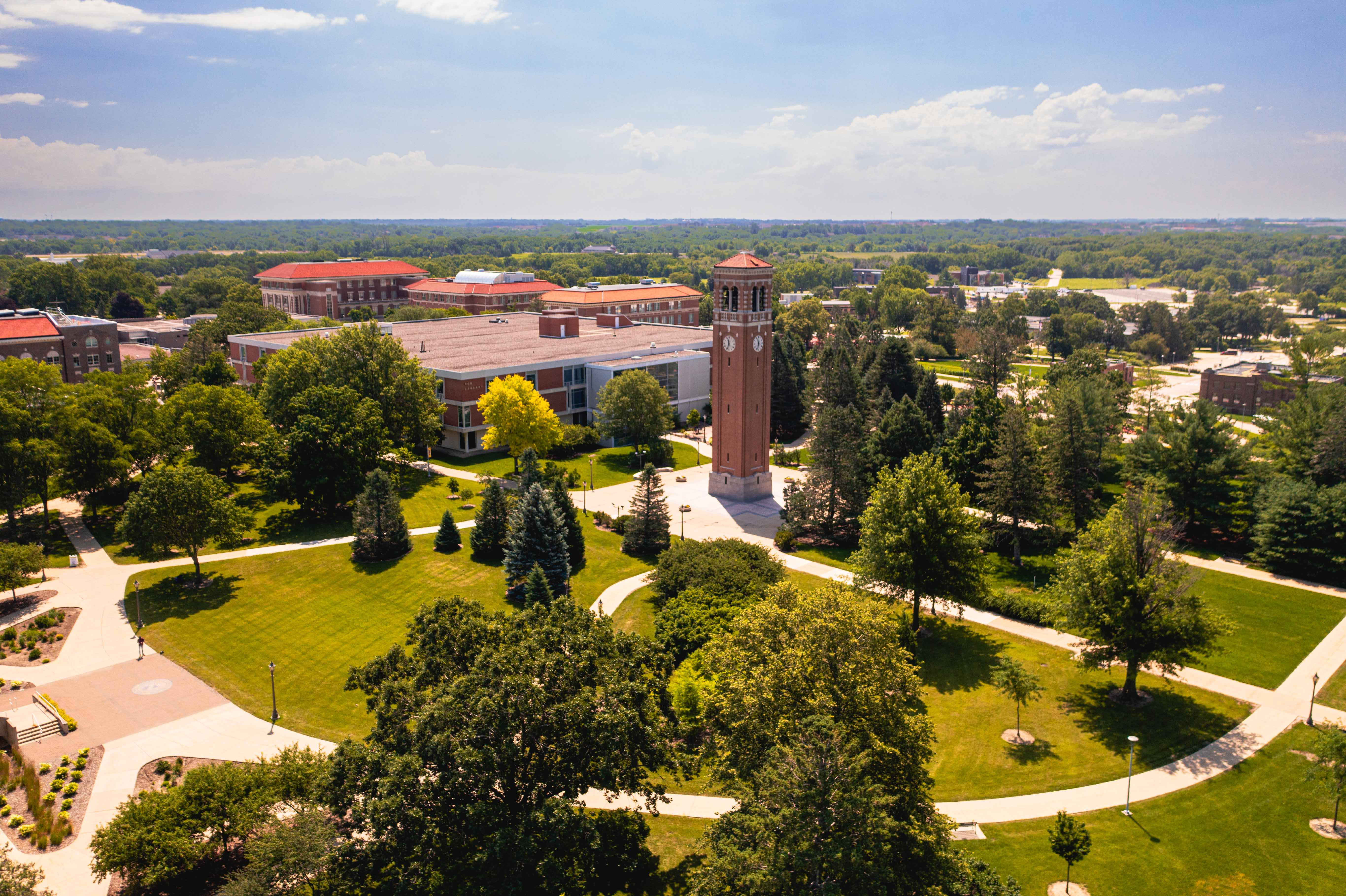 Wide drone shot of the UNI Campanile during summer