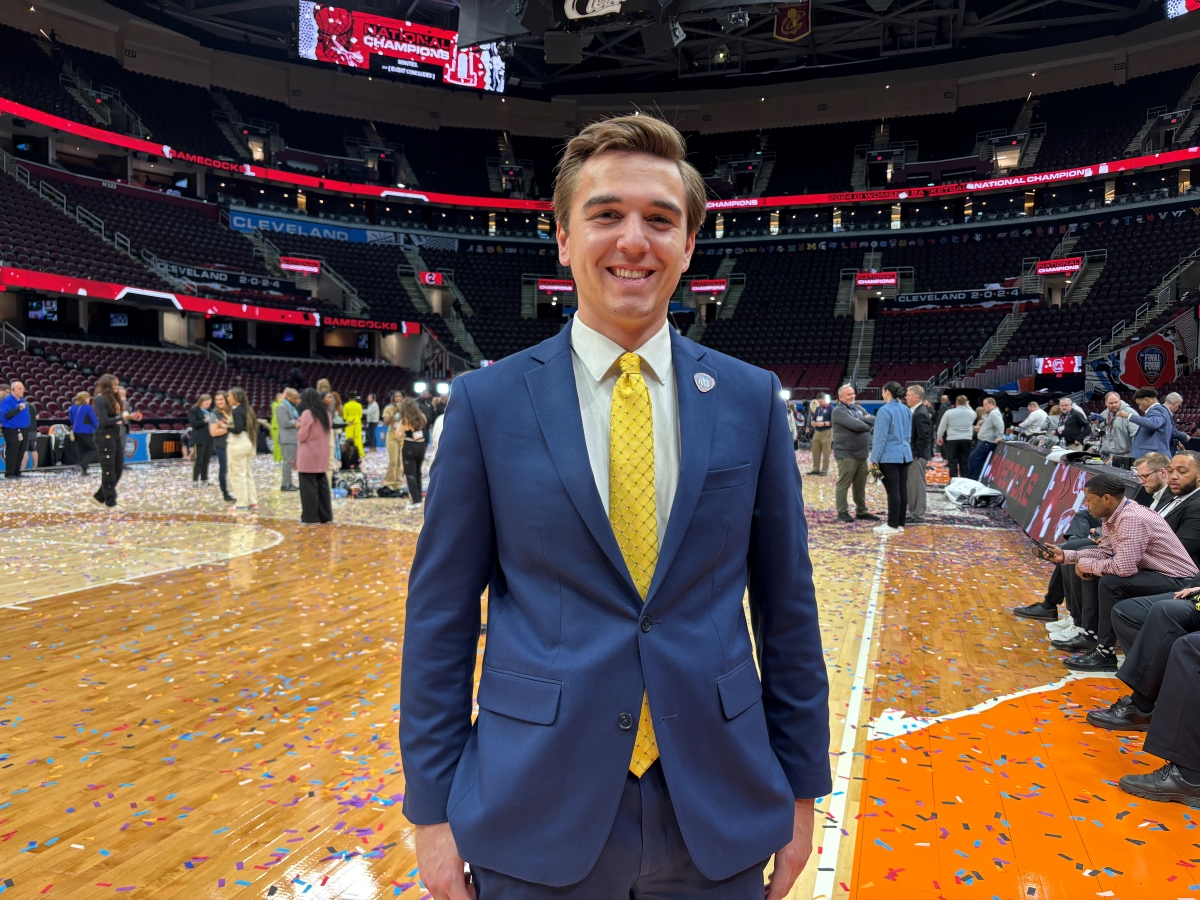 David Warrington in a suit at women's Final Four game