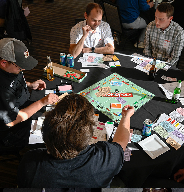 Real estate students and professionals playing Monopoly