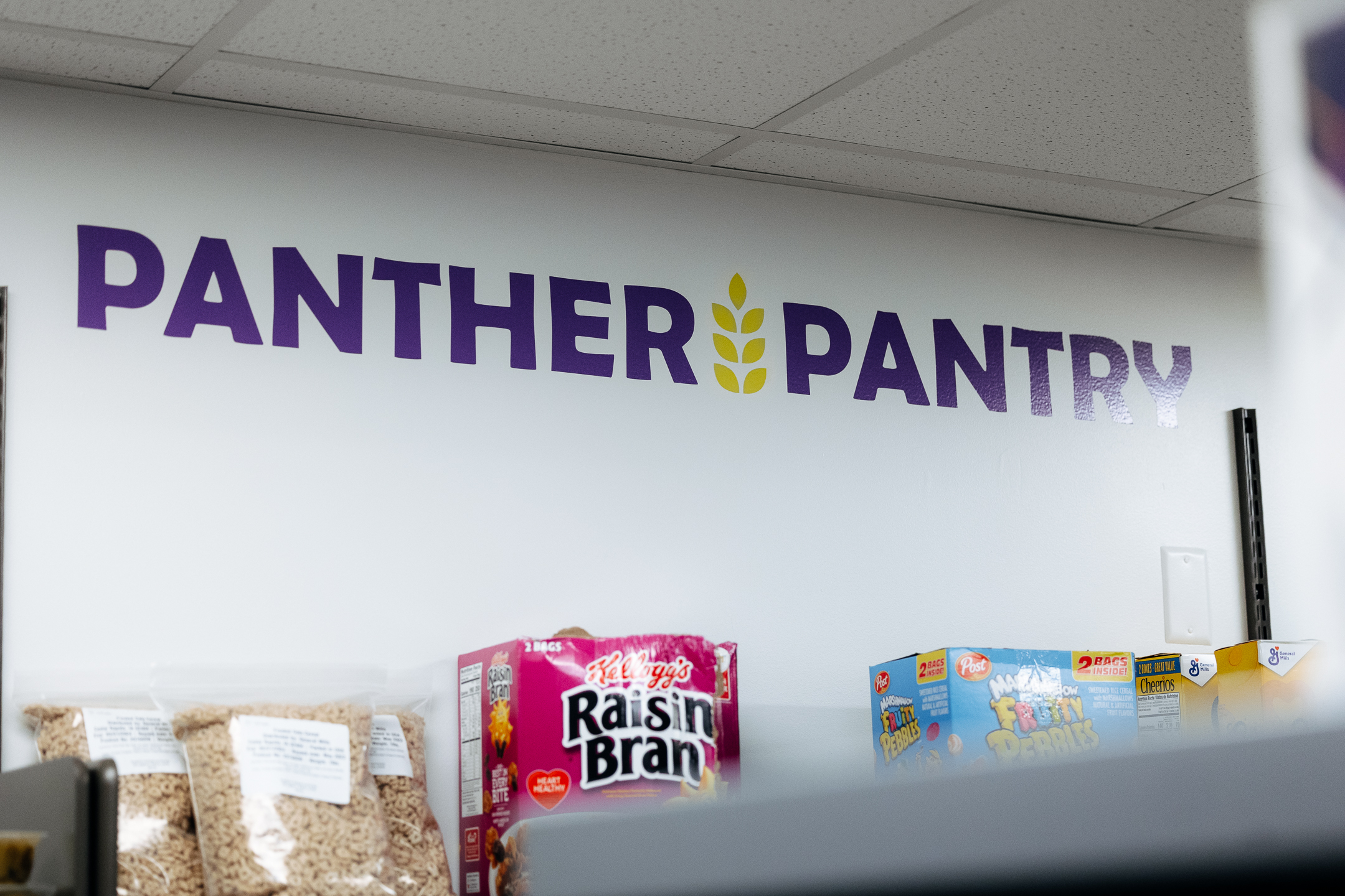 Shelves stocked with cereal at the Panther Pantry