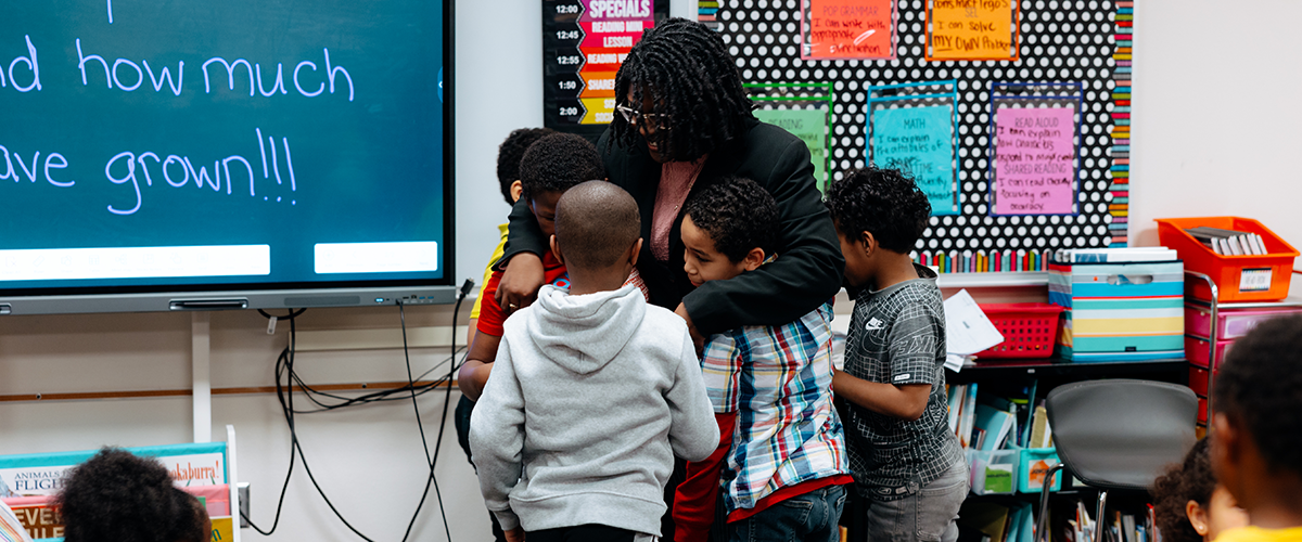 Teacher with students in classroom