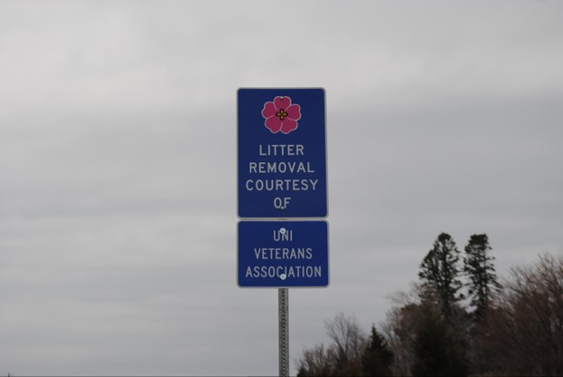 Highway sign that says "Litter removal courtesy of UNI Veterans Association" 