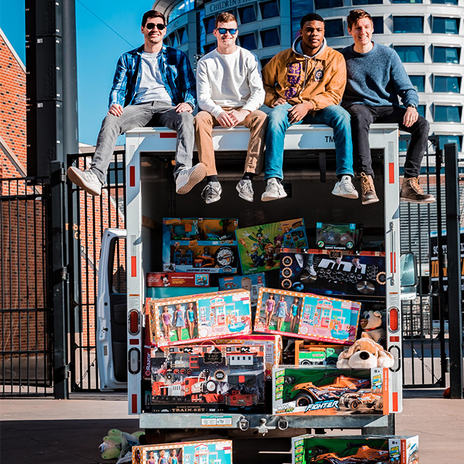 Founders of Iowa Chill stilling stop Uhaul trailer.