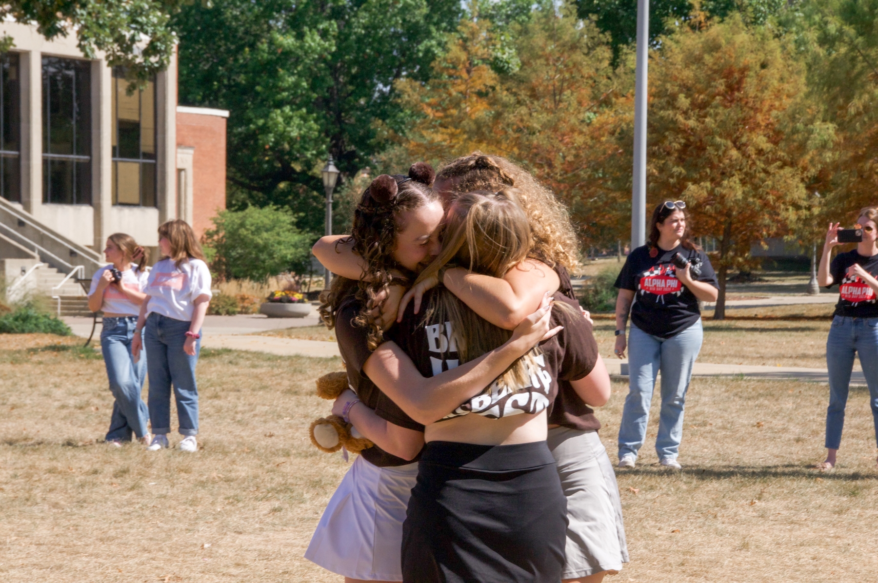 Kate Rogers hugging her sorority sisters