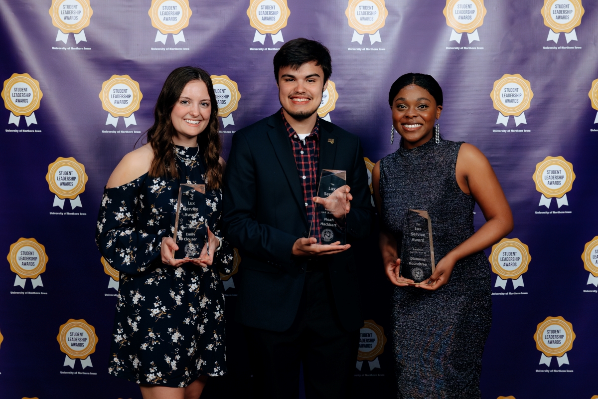 Emily Clouser, Noah Hackbart and Diamond Roundtree with their Lux Service Awards