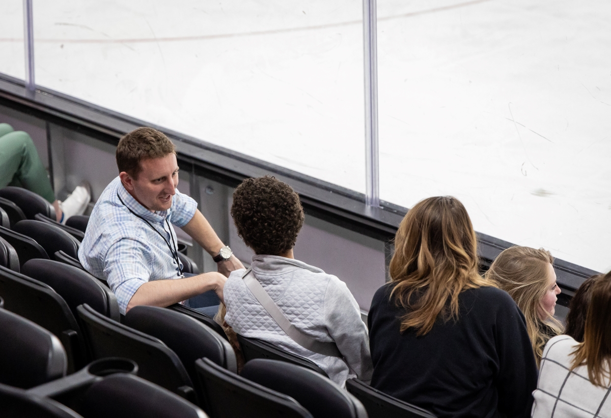 Matt Getz talking to fans at hockey game