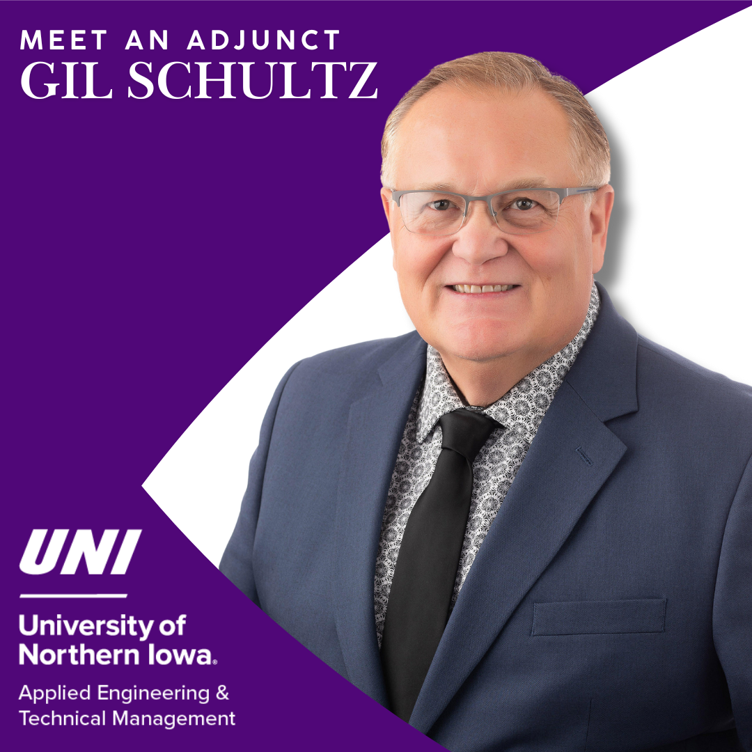 Man smiling in suit with purple and white background