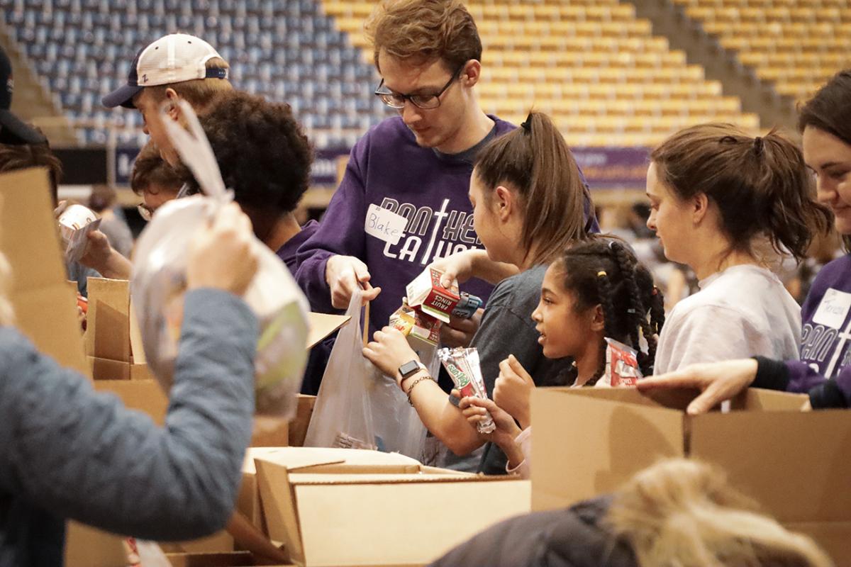 Students packing presents.