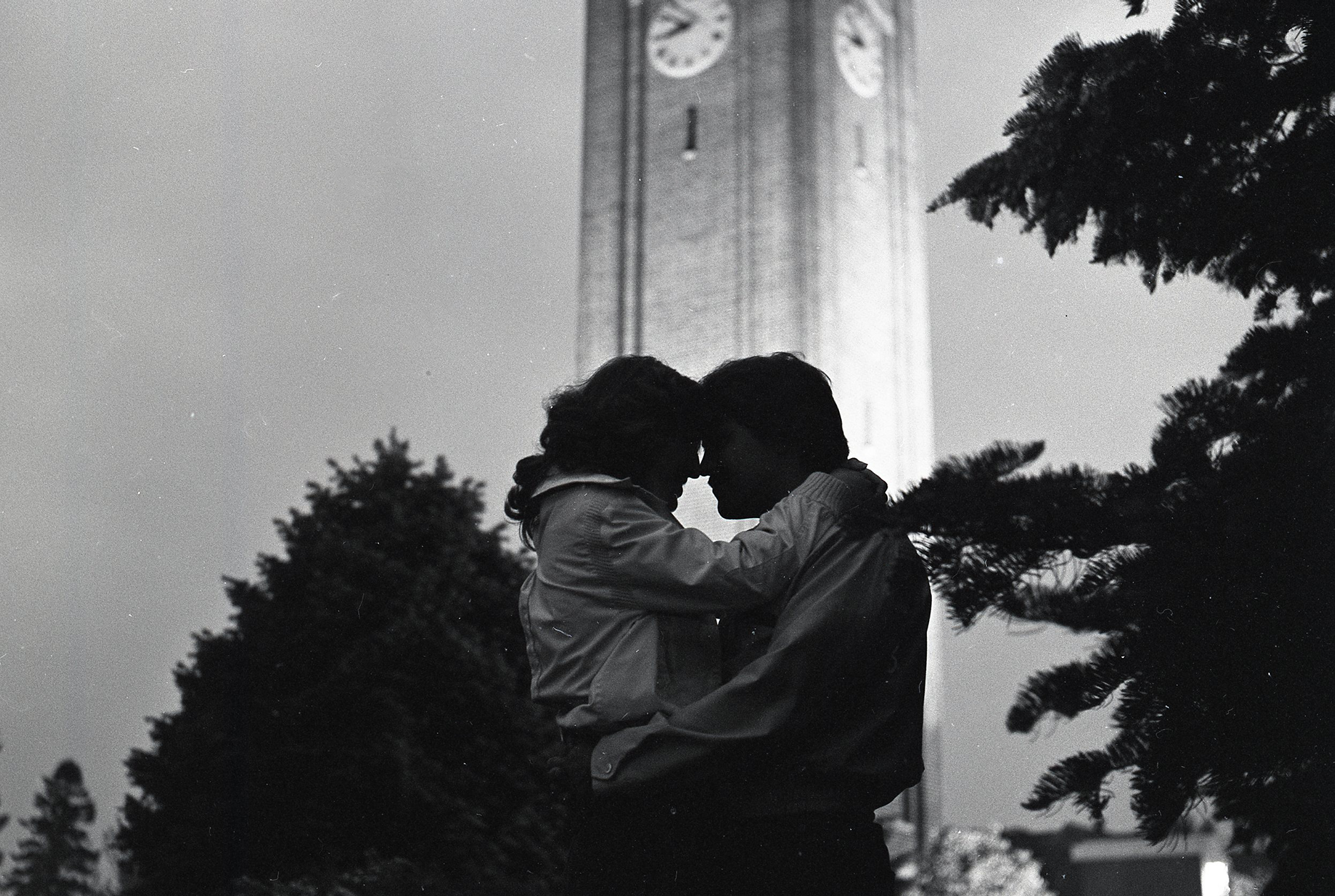 A couple embraces under the Campanile on the UNI campus