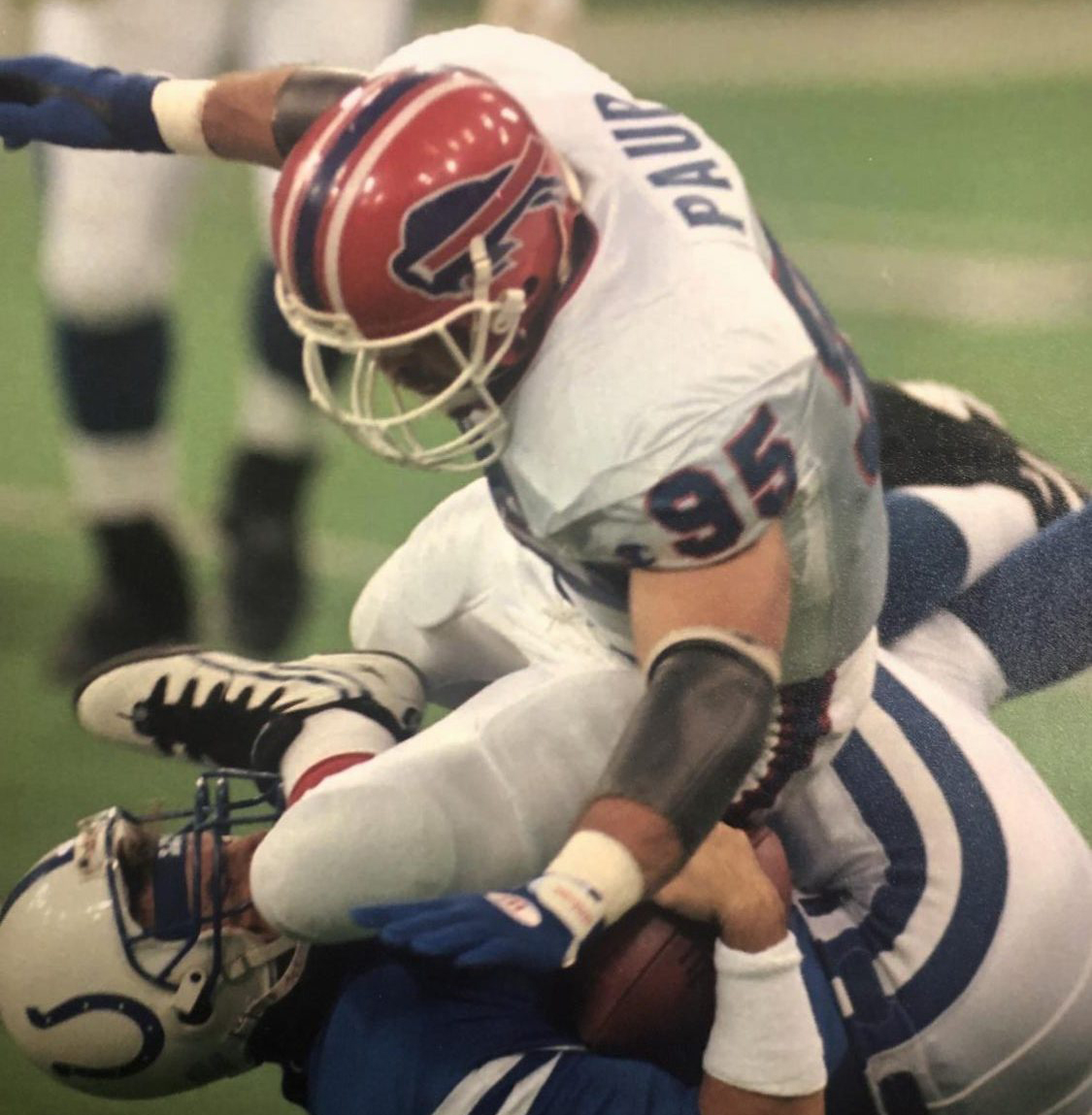 Bryce Paup tackles an opponent in the NFL