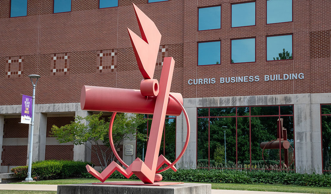 The red statue in front of UNI's Curris Business Building