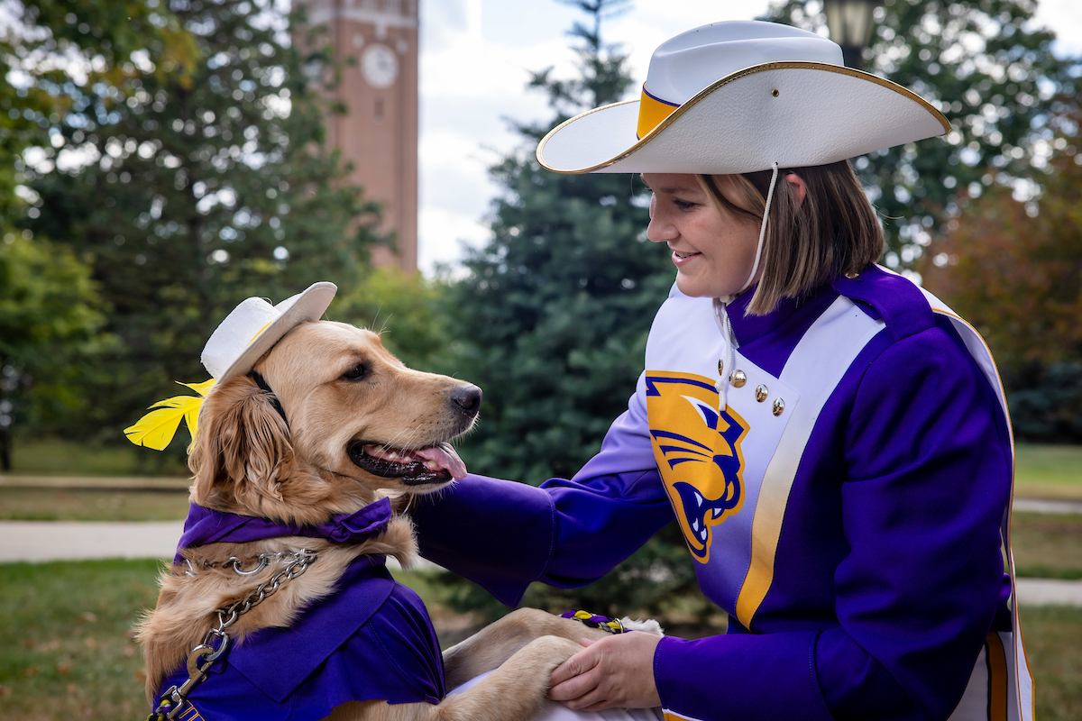 Gabi Riessen shaking paws with Winnie her service dog