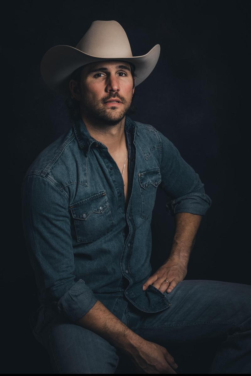 Justin Adams in a cowboy hat