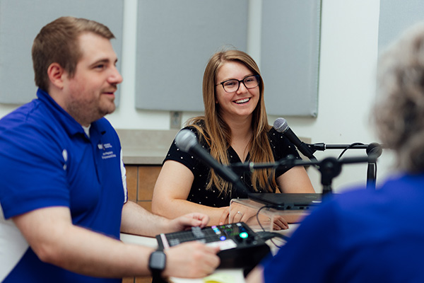 Hosts of Building a Better Iowa Podcast in studio