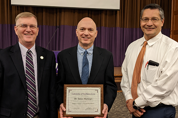 Mattingly (center) pictured with President Nook (left) and Provost Herrera (right).