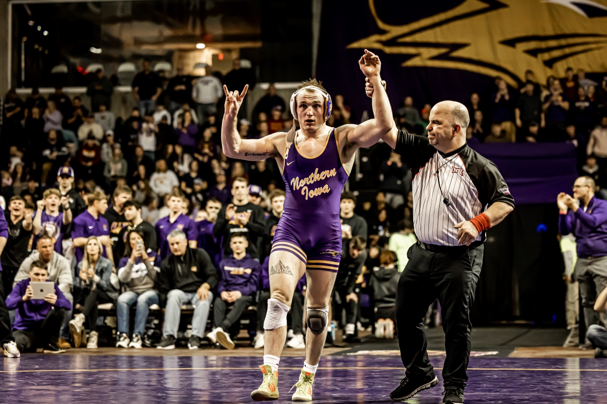 Wrestler with his arms in the air victoriously