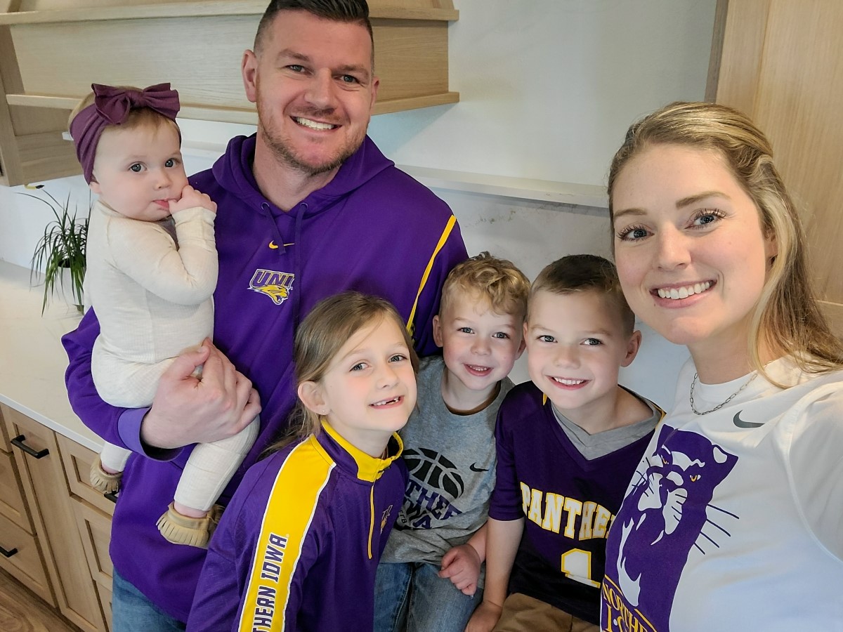 Austin Pehl with wife and four kids in UNI gear
