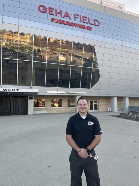 Aaron Dzaboff in front of Geha Field Arrowhead in Chiefs polo