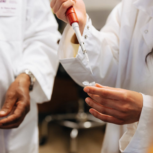 UNI biology students working with syringes